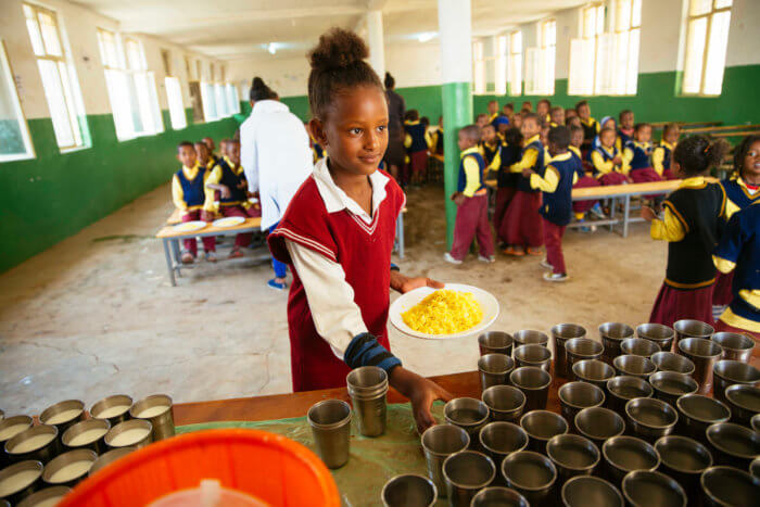 A girl gets food at her school
