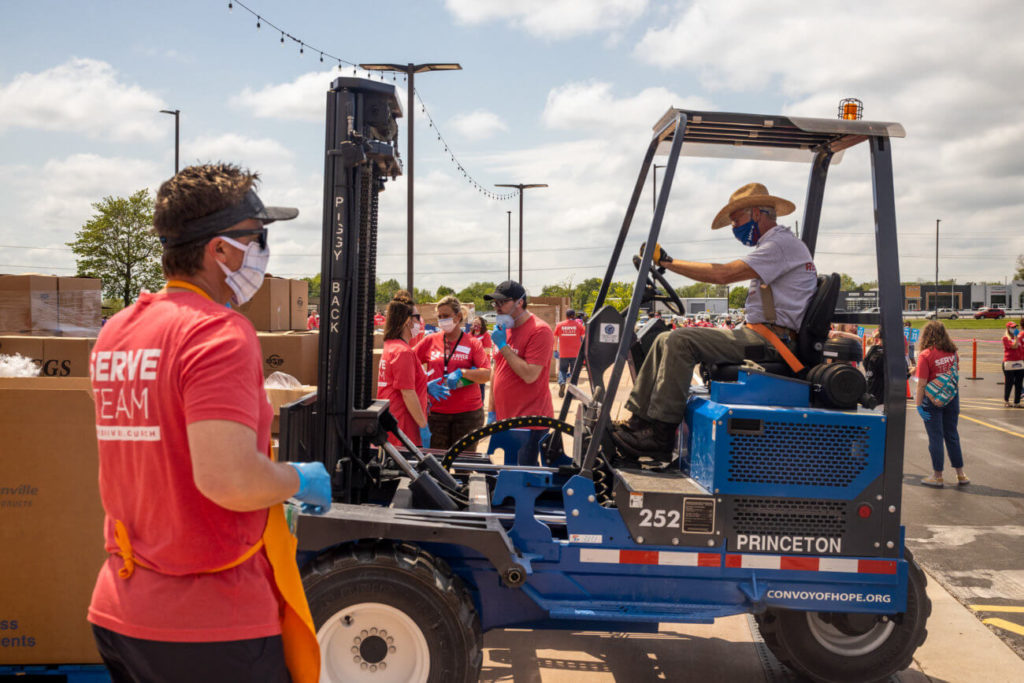 Ozark, Missouri – Dozens of pallets of food and supplies are unloaded at James River Church to be distributed throughout their area.